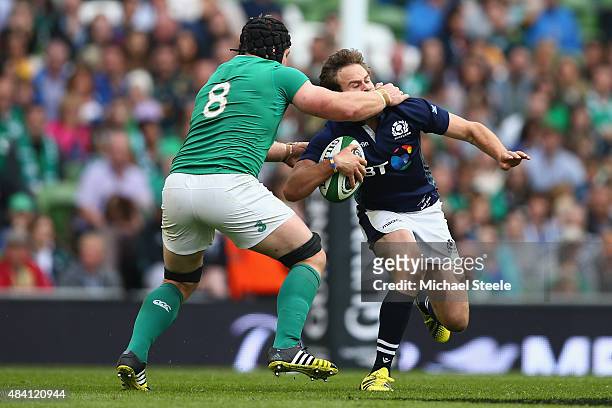 Ruaridh Jackson of Scotland is on the wrong side of a high tackle by Sean O'Brien of Ireland during the International match between Ireland and...
