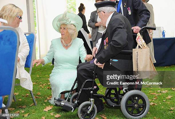 Camilla, Duchess of Cornwall meets veterans during the 70th Anniversary commemorations of VJ Day at the Royal British Legion reception in the College...