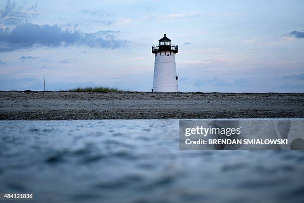The Edgartown lighthouse is seen during dawn August 15, 2015 in Edgartown, Massachusetts on Martha's Vineyard. AFP PHOTO/BRENDAN SMIALOWSKI