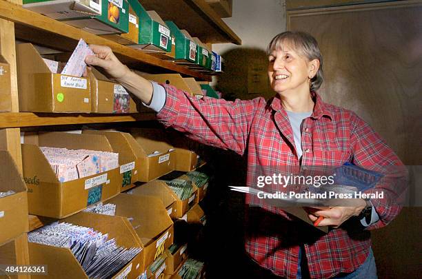 Staff Photo by John Ewing, Friday, January 20, 2006: Yvette Knight,an employee at Pinetree Garden Seeds in New Gloucester, fills a seed order for a...