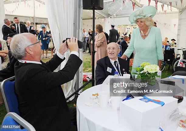 Camilla, Duchess of Cornwall meets veterans during the 70th Anniversary commemorations of VJ Day at the Royal British Legion reception in the College...