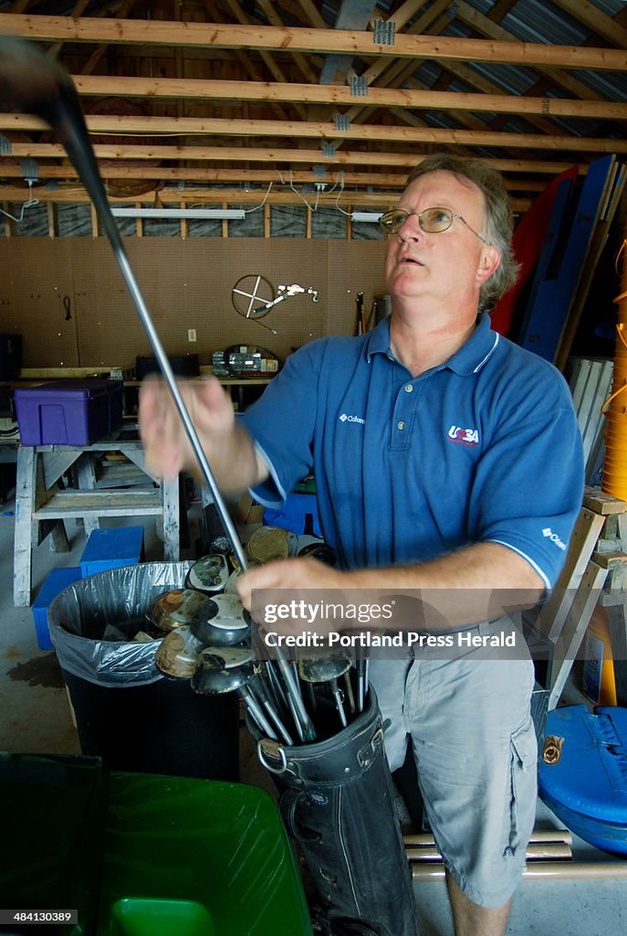 Mark Capano, vice president of programs for Special Olympics Maine, sorts golf clubs into sets Frida...