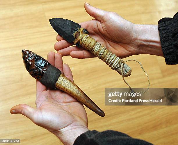 Staff Photo by Gordon Chibroski, Thursday, January 12, 2006: Arthur Haines shows two primitive knives he made using primitive knapping techniques he...