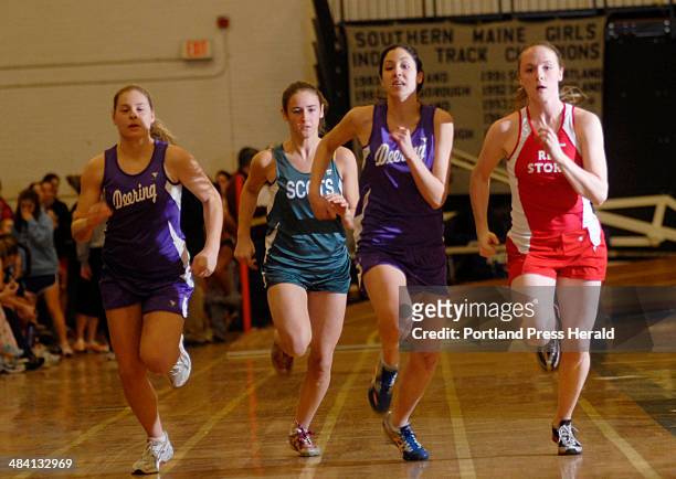Staff Photo By Shawn Patrick Ouellette: -- In the 300 yard dash section 2 race Scarborough's Kira Gordon, right, is in the lead with Deering's...