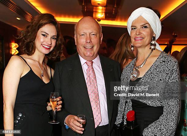 Lily James, Julian Fellowes and wife Emma Joy Kitchener attend the Downton Abbey wrap party at The Ivy on August 15, 2015 in London, England.