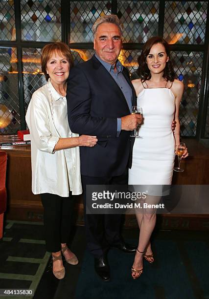 Penelope Wilton, Jim Carter and Michelle Dockery attend the Downton Abbey wrap party at The Ivy on August 15, 2015 in London, England.