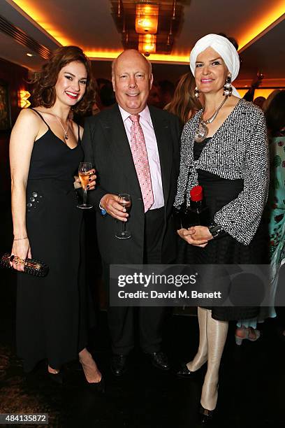 Lily James, Julian Fellowes and wife Emma Joy Kitchener attend the Downton Abbey wrap party at The Ivy on August 15, 2015 in London, England.