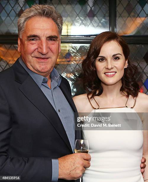 Jim Carter and Michelle Dockery attend the Downton Abbey wrap party at The Ivy on August 15, 2015 in London, England.