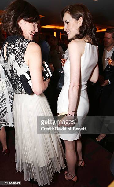 Elizabeth McGovern and Michelle Dockery attend the Downton Abbey wrap party at The Ivy on August 15, 2015 in London, England.
