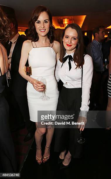 Michelle Dockery and Sophie McShera attend the Downton Abbey wrap party at The Ivy on August 15, 2015 in London, England.