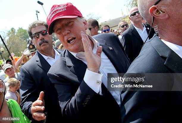 Republican presidential candidate Donald Trump greets fairgoers while campaigning at the Iowa State Fair on August 15, 2015 in Des Moines, Iowa....