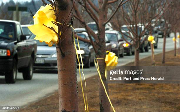 Staff photo by Doug Jones -- Tuesday, March 27, 2007: The family of Jason Swiger, the latest fallen soldier in Iraq, tied yellow ribbons on telephone...