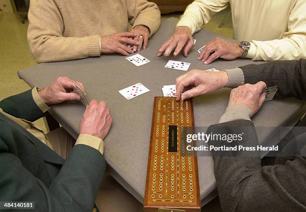 Staff Photo by Derek Davis, Friday, October 29, 2004: Members play games of cribbage at Woodford's Club in Portland. Every Friday the club holds a...