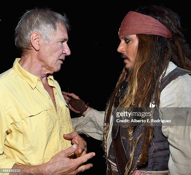 Actors Harrison Ford of STAR WARS: THE FORCE AWAKENS and Johnny Depp, dressed as Captain Jack Sparrow, of PIRATES OF THE CARIBBEAN: DEAD MEN TELL NO...