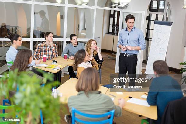 lecturing students at university - management student stockfoto's en -beelden