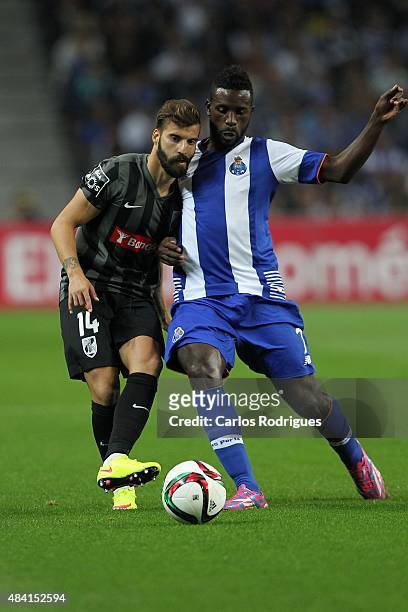 Porto's forward Silvestre Varela vies with Guimaraes's midfielder Alex during the match between FC Porto and Vitoria Guimaraes for the Portuguese...