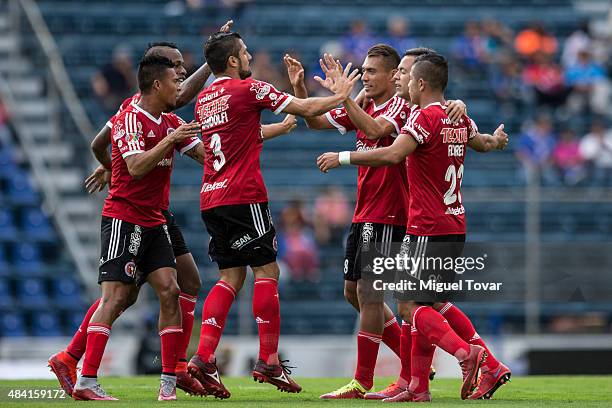 Juan Arango of Tijuana celebrates with teammates after scoring the second goal of his team during a 5th round match between Cruz Azul and Tijuana as...