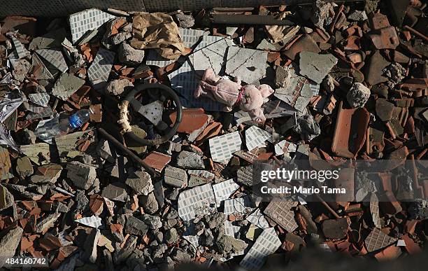 Rubble remains at a partially demolished home in the Vila Autodromo 'favela' community on August 15, 2015 in the Barra da Tijuca neighborhood of Rio...