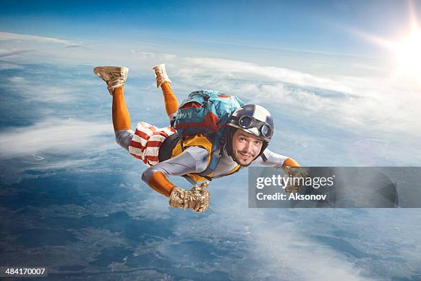 circus skydiver falls through the air. - parachute stockfoto's en -beelden