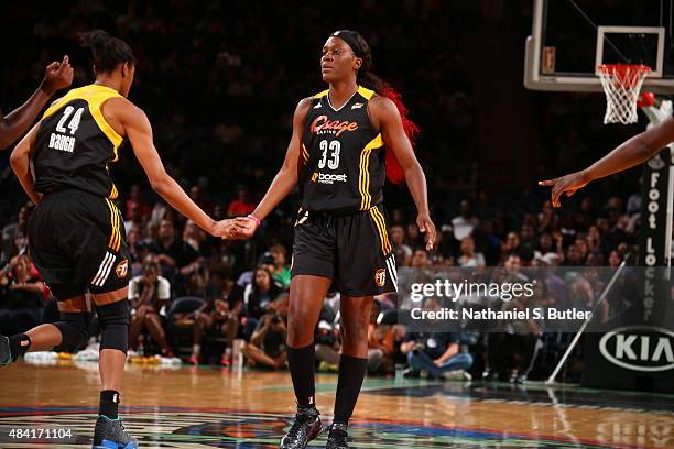 Tiffany Jackson-Jones of the Tulsa Shock hi fives her teammates during a game against the New York Liberty on August 15, 2015 at Madison Square...