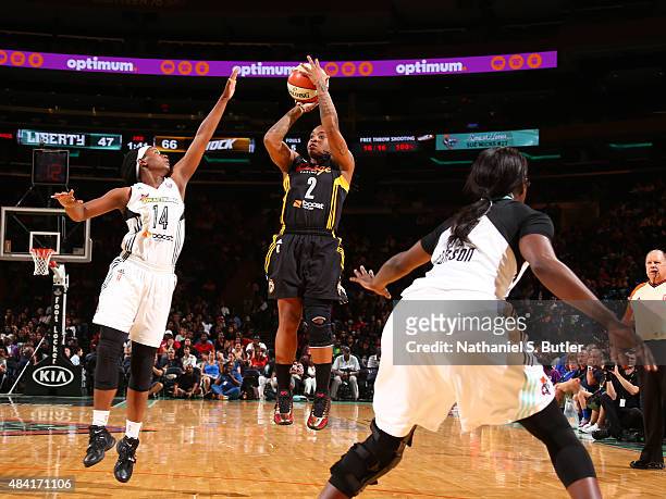 Riquna Williams of the Tulsa Shock shoots the ball against Sugar Rodgers of the New York Liberty on August 15, 2015 at Madison Square Garden, New...