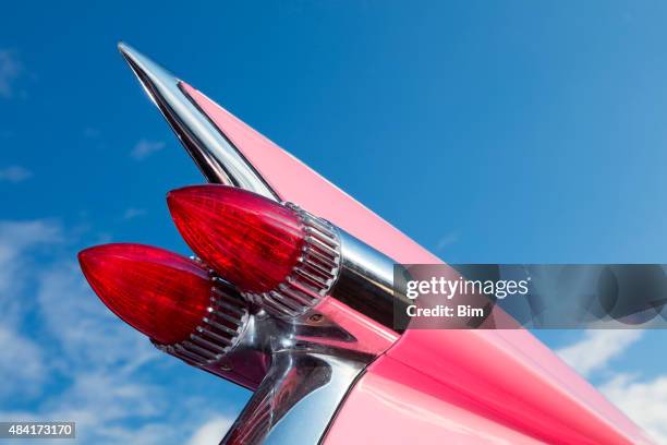 tail fin of classic car, 1959 pink cadillac de ville - cadillac stock pictures, royalty-free photos & images