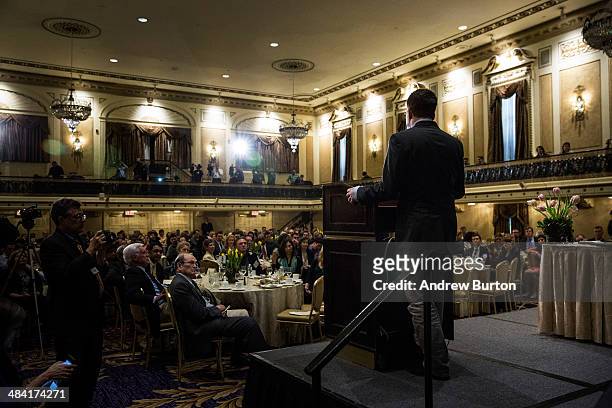 Investigative reporter Glenn Greenwald, who worked with National Security Agency leaker Edward Snowden, accepts the George Polk Award along side...
