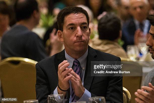 Investigative reporter Glenn Greenwald, who worked with National Security Agency leaker Edward Snowden, attends the George Polk Award along side...