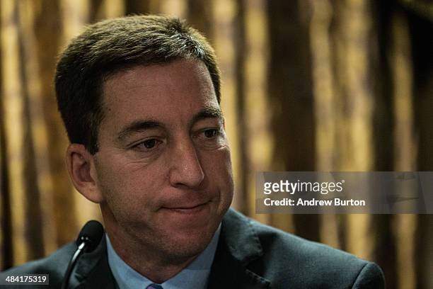 Investigative reporter Glenn Greenwald, who worked with National Security Agency leaker Edward Snowden, speaks at a press conference after accepting...
