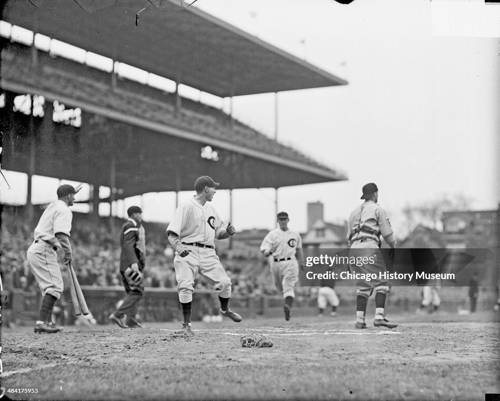 Chicago Cubs Player Crossing Home Plate At Wrigley Field