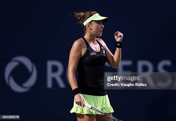 Belinda Bencic of Switzerland celebrates a point against Serena Williams of the USA during Day 6 of the Rogers Cup at the Aviva Centre on August 15,...