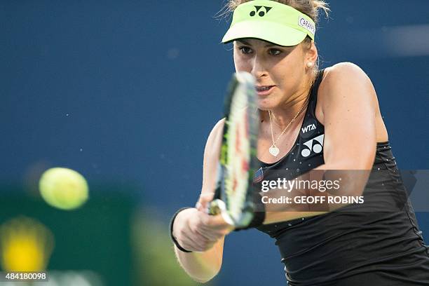 Belinda Bencic of Switzerland returns the ball to Serena Williams of the United States during their semi-final match at Aviva Centre at York...