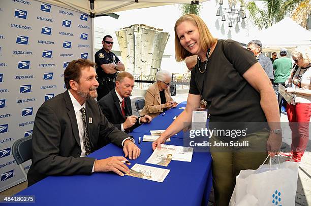 Director Fraser Heston, Governor of the United States Postal Service Mickey D. Barnett, and CEO and Director of AFI Jean Picker Firstenberg attend...