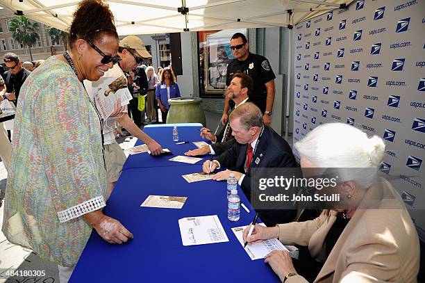 Director Fraser Heston, Governor of the United States Postal Service Mickey D. Barnett, and CEO and Director of AFI Jean Picker Firstenberg attend...