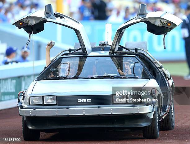 Actress Lea Thompson arrives in a DeLorean to throw out the first pitch before the game between the Cincinnati Reds and the Los Angeles Dodgers at...