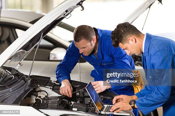 auto mechanic and technician - mechanic computer stock pictures, royalty-free photos & images