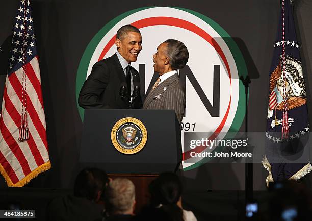 President Barack Obama greets Rev. Al Sharpton, president of the National Action Network at their 16th annual convention at the Sheraton New York...
