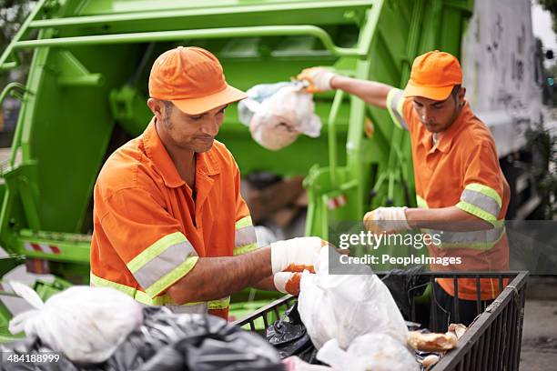 dealing with your mess daily - garbage man stock pictures, royalty-free photos & images