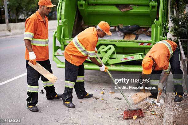 giving work their all! - street sweeper stock pictures, royalty-free photos & images