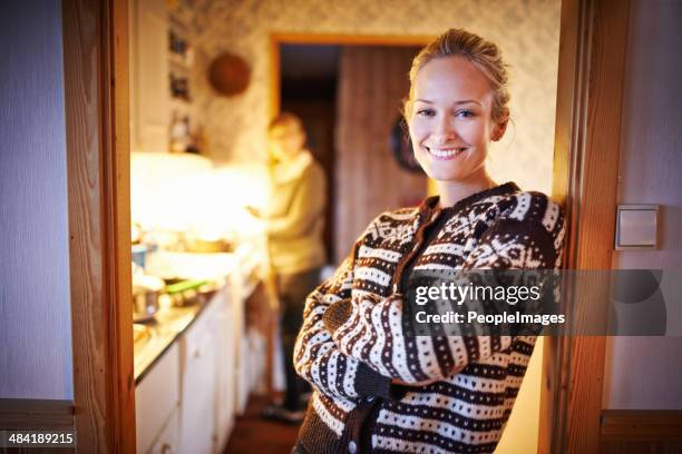 welcome to my warm, cosy home - woman standing in doorway stock pictures, royalty-free photos & images