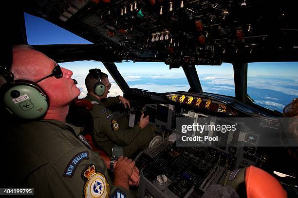 Royal New Zealand Air Force P-3 Orion flown by Flt Lt Tim McAlevey takes part in the search to locate missing Malaysia Airways Flight MH370 at sea...