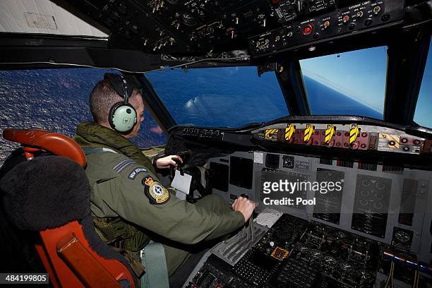 Captain Flt Lt Tim McAlevey of the Royal New Zealand Air Force flying a P-3 Orion during a search to locate missing Malaysia Airways Flight MH370 at...