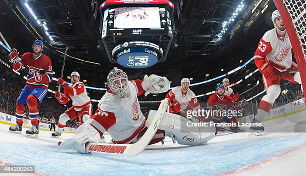 Jonas Gustavsson of the Detroit Red Wings stops a shot against the Montreal Canadiens during the NHL game on April 5, 2014 at the Bell Centre in...
