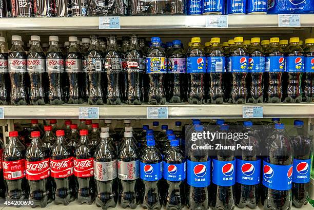 Pepsi and Coca-Cola products in a Chinese supermarket. Coke companies are suffering large decline in consumption of sugary sodas as consumers worry...