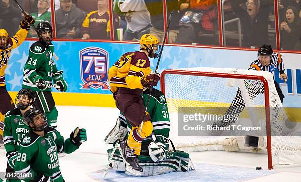 Seth Ambroz of the Minnesota Golden Gophers reacts as the puck is in the net on a winning goal by teammate Justin Holl with only .6 seconds remaining...