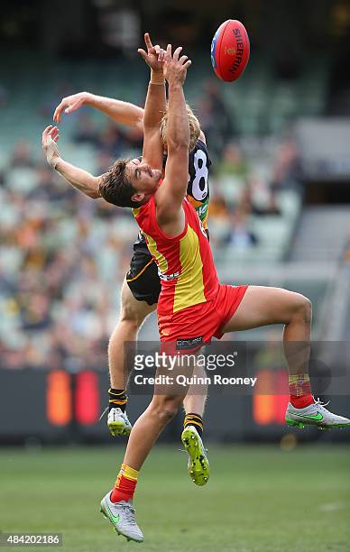 Andrew Boston of the Suns marks infront of Steven Morris of the Tigers during the round 20 AFL match between the Richmond Tigers and the Gold Coast...