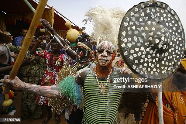 Members of Sudan's Nuba community wearing tribal outfits take part in the Nuba Mountains Cultural Heritage Festival, marking the International Day of...