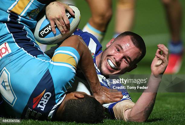 David Klemmer of the Bulldogs scores a try during the round 23 NRL match between the Canterbury Bulldogs and the Gold Coast Titans at Central Coast...