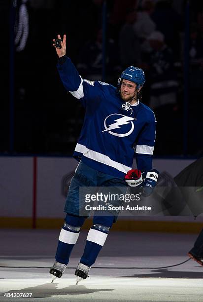 Victor Hedman of the Tampa Bay Lightning thanks fans for their support during the win against the Toronto Maple Leafs at the Tampa Bay Times Forum on...