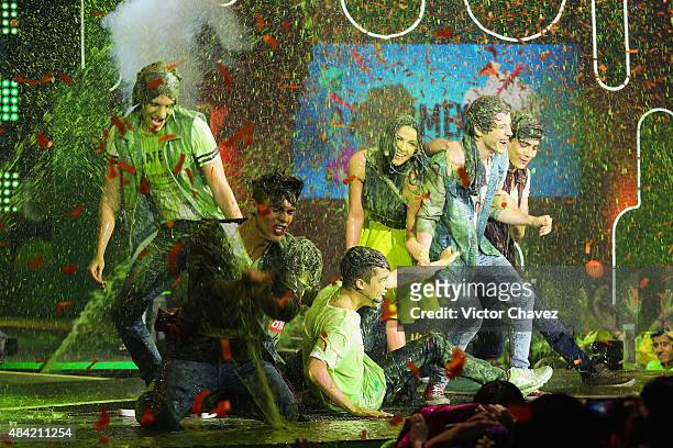 Maite Perroni and members of the band CD9 get slimed onstage during the Nickelodeon Kids' Choice Awards Mexico 2015 at Auditorio Nacional on August...